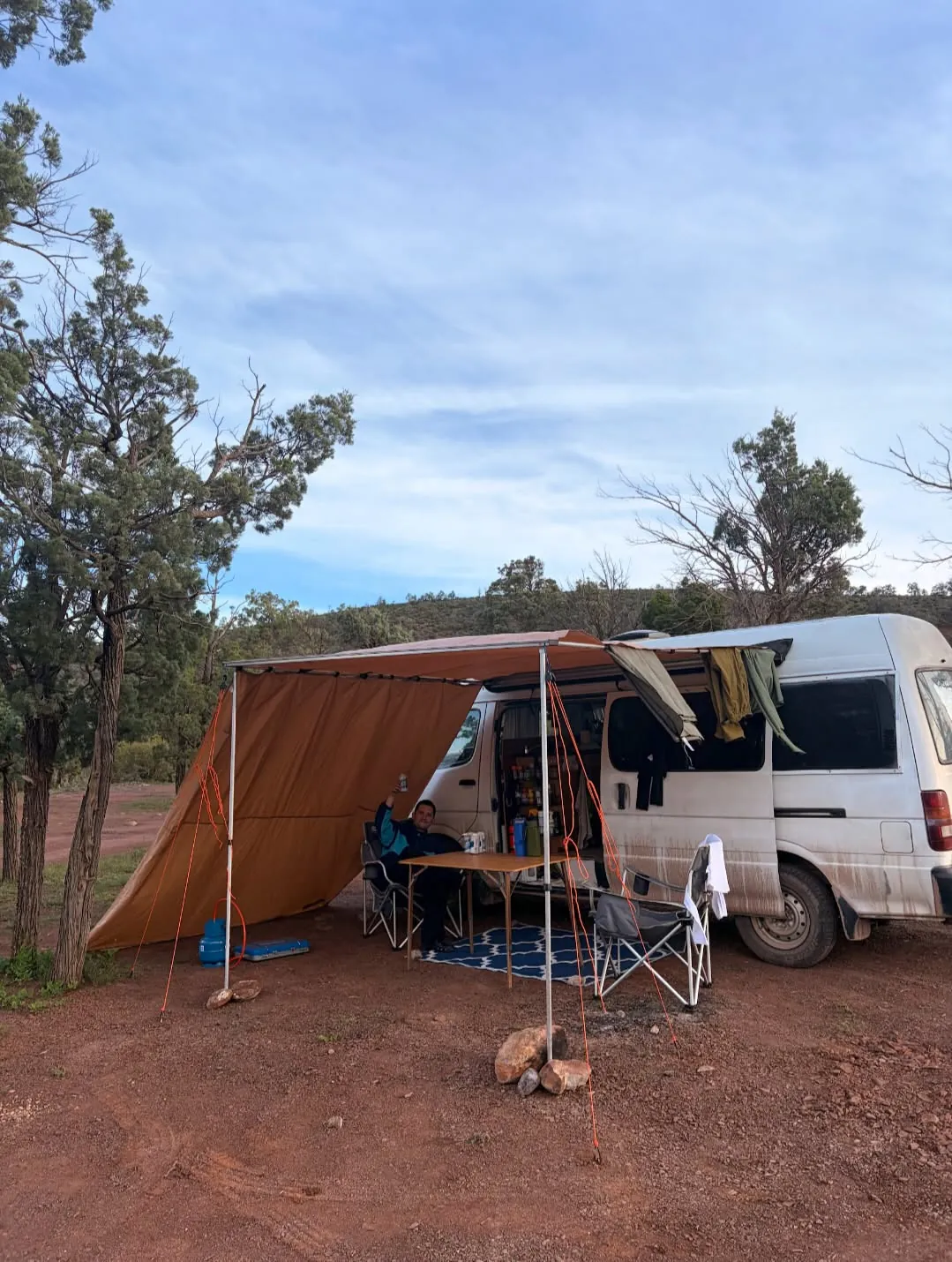 Hank with the awning and side walls set up at a bush camp